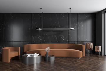 Dark meeting room interior with couch, armchair and coffee table