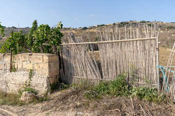 The poor fence made from straw or bamboo