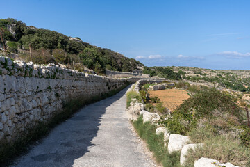 Hiking along beautiful Maltese coastline of Mistra Bay