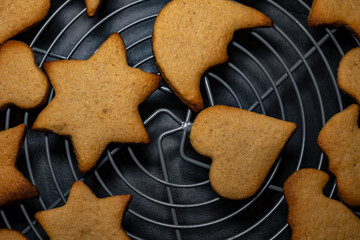 top view of christmas cake. heart and star shaped cake. close up on dry cakes coming out of the oven