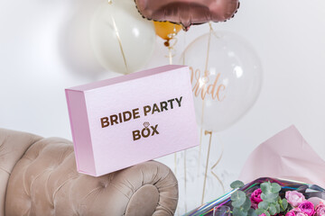 Box with decor for the bride's bachelorette party.
