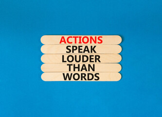 Actions speak louder words symbol. Concept words Actions speak louder than words on wooden stick. Beautiful blue table blue background. Business new mindset for results concept. Copy space.