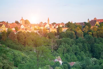 Fototapeten Panoramic aerial view of the town with green forest and sunlight background of Rothenburg in a beautiful summer day, Rothenburg Tauber is a city in the Franconia region of Bavaria, Germany. © sornchai