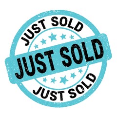 JUST SOLD text written on blue-black round stamp sign.