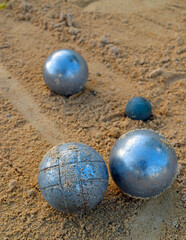 The game of pétanque or boules , played in France