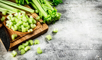 Sliced celery on a cutting board. 