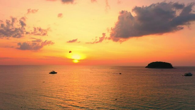 aerial view scenery sweet sky the sun down to the sea..beautiful sky at sunset in Kata beach Phuket Thailand.4k stock footage video in travel concept. cloud in sky background.