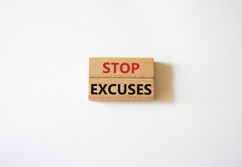 Stop excuses symbol. Concept words Stop excuses on wooden blocks. Beautiful white background. Business and Stop excuses concept. Copy space.