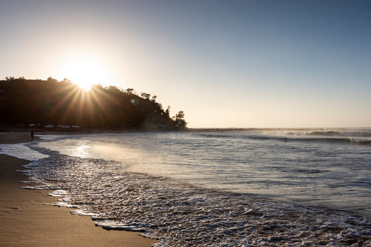 Australian Surf at sunrise with sun flare