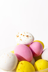 Fototapeta na wymiar Colorful chocolate Easter eggs on white background with copy space