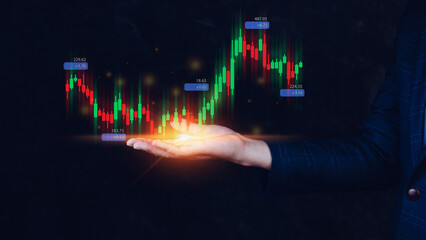 Hand of businessman or trader is showing growing virtual hologram stock, planning and strategy, Stock market, Business growth, progress or success concept. invest in trading.