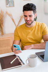 Happy man working on laptop