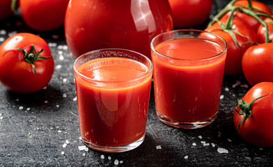 Juice from ripe tomatoes in a glass. 