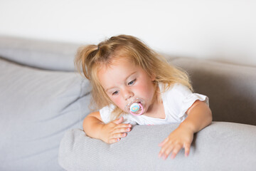 Thoughtful child pops out of couch