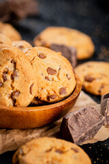 Homemade cookies with chocolate. Against a dark background
