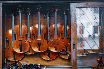 Old musical instruments - violins and cello © Maryna Konoplytska