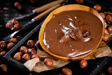 A plate of hazelnut butter on a cutting board.