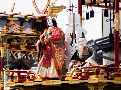 Takayama, Japan - October 9, 2015: Wooden doll figures on top of decorative float during Autumn Takayama Festival