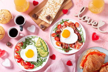 Couple breakfast on Valentines Day on pink background, top view