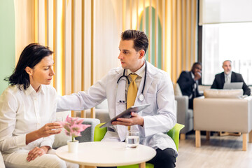 Fototapeta premium Man doctor wearing uniform with stethoscope service help support discussing and consulting talk to sick senior woman patient about checkup result information in hospital.healthcare and medicine
