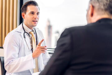 Man doctor wearing uniform with stethoscope service help support discussing and consulting talk to sick senior man patient about checkup result information in hospital.healthcare and medicine