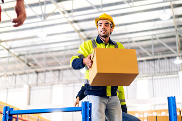 Two engineer team shipping order detail hold box check goods and supplies on shelves with goods background inventory in factory warehouse.logistic industry and business export