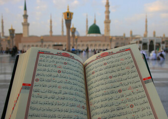 Reading the Holy Quran in The Prophet Mosque in Medina, Saudi Arabia