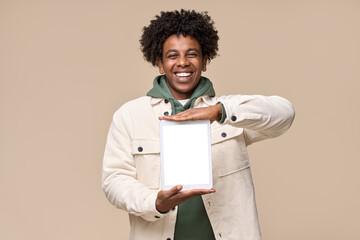 Happy African American teenager student boy wearing white jacket holding pad using digital tablet...