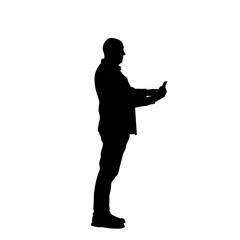 Silhouette of a man using a cell phone