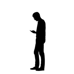 Silhouette of a man using a cell phone