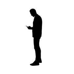 Silhouette of a man using a cell phone