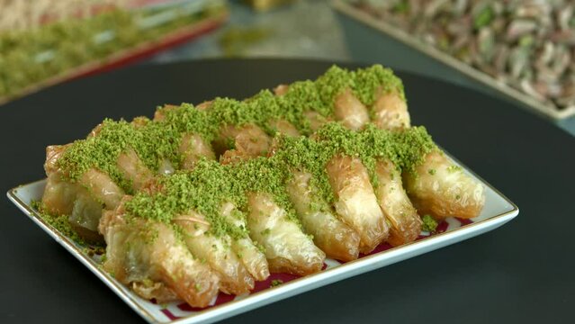 Traditional turkish baklava pistachio pastry. Dilberdudagi, ozel kesim baklava, cikolatali baklava, fistikli baklava, katmer, fistikli kadayif, kattafi, fistik sarma, soguk baklava, midye baklava, cev