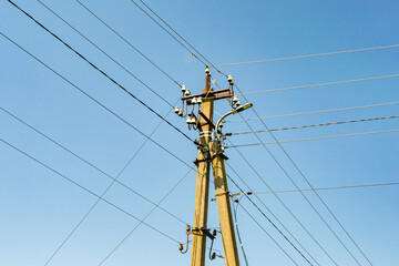 Power electric pole with line wire on colored background close up