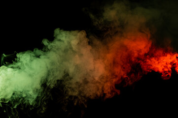 Red yellow green smoke on a black background.