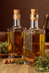 Bottles of olive oil with herbs and spices.