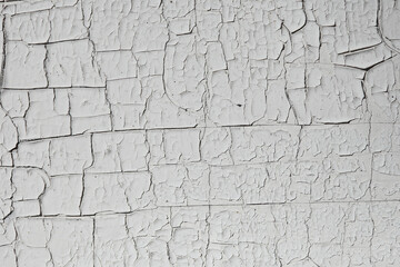 Texture of a gray painted surface in cracks.