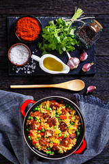 smoked sausages with rice and vegetables, top view