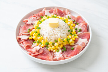 fresh pork raw sliced with rice and corn on plate and ready to cook
