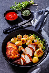 grilled chicken breasts with browned new potatoes