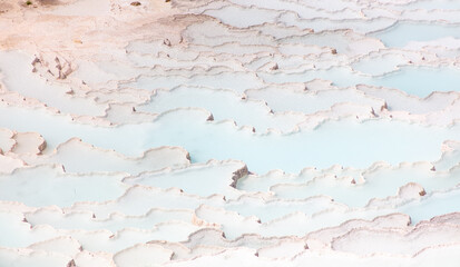 Emerald water in white limestone rock.