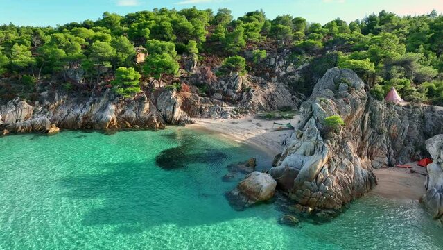 Beautiful orange beach Kavourotripes , Sitonia, Halkidiki, Greece. Aerial shot of lagoon with turquoise water, sandy beach and pine trees