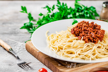 Delicious spaghetti bolognese with parsley. 