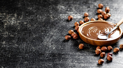 Hazelnut butter in a plate with a spoon. 