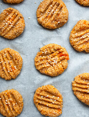 Cooking homemade cookies from oatmeal, banana and dried apricots. Diet cookies on parchment. A healthy snack. Proper nutrition.