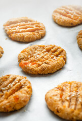 Cooking homemade cookies from oatmeal, banana and dried apricots. Diet cookies on parchment. A healthy snack. Proper nutrition.