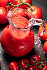 A full jug of tomato juice. 