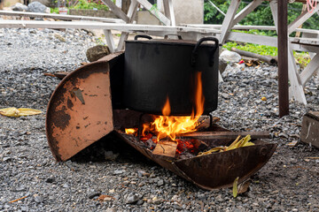Vietnam, traditional cooking on open fire place.