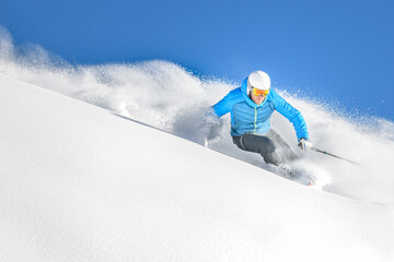 A skier in powder off-piste - 563616062