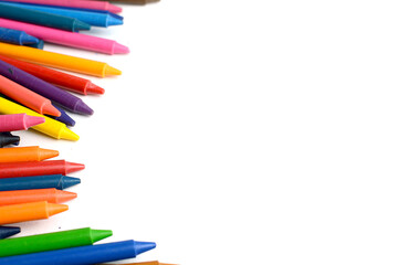 Crayons lined up isolated on white background.