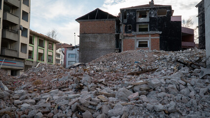 Earthquake damage in a city. Destroyed buildings after an earthquake. Collapsed buildings. Ruined...